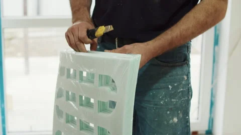 Worker Unpacking Floor Underlayment Sheet Stock Footage 322054774