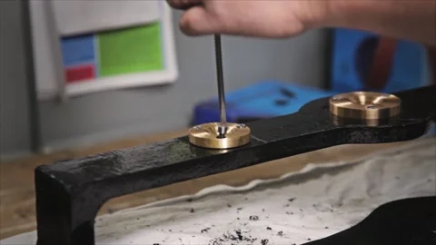Worker Unscrewing Brass Bushing from Metal Machinery Stock Footage 345749850