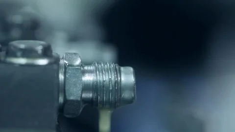 Worker unscrewing hose from unit. Engineer working with hydraulic pressure hoses Stock Footage 98682483