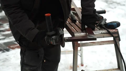 Worker use an Angle Grinder producing. Bright sparks and flashes Stock Footage 263801858