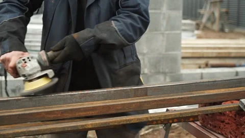 Worker use an Angle Grinder producing. Bright sparks and flashes Stock Footage 263801860