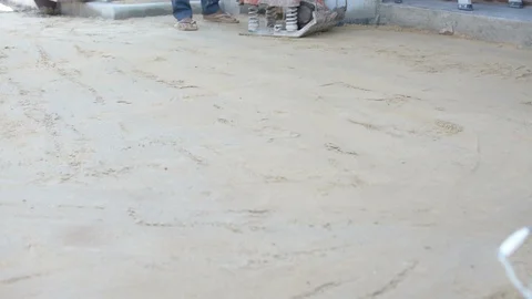 Worker use vibratory plates seals the base sand Stock Footage 98734722