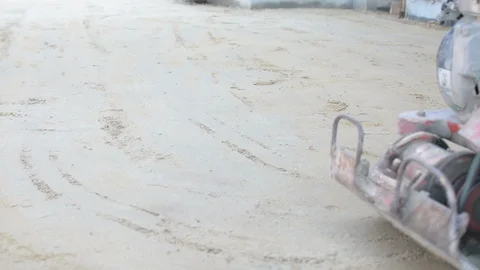 Worker use vibratory plates seals the base sand Stock Footage 98746793