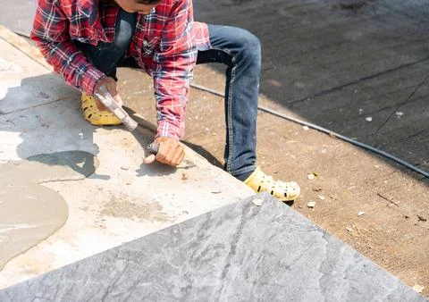 The worker used the chisel incorrectly on the cement Stock Photos