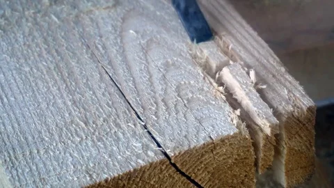 A worker uses a chisel to work with wood Board Video stock 75914038