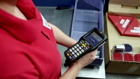 Worker uses data terminal for identification of goods Stock Footage 240212900