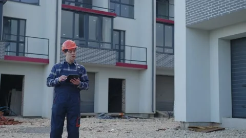 Worker uses his tablet fot the project 動画素材 157869745