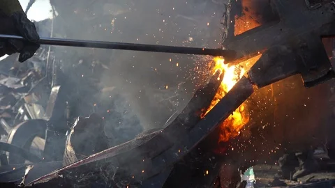 A worker uses a oxygen acetylene cutting torch to cut scrap, close up Stock Footage 103681647