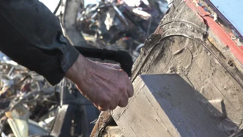 A worker uses a oxygen acetylene cutting torch to cut scrap, close up 動画素材 103682101