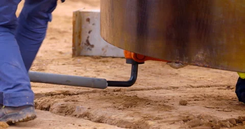 Worker uses a pipe and a huge hex key to tighten the mount Stock Footage 147638578
