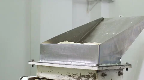 Worker uses prepared dough to be baked into bagels Stock Footage 50302969