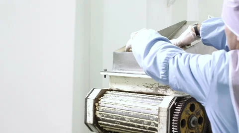 Worker uses prepared dough to be baked into bagels Stock Footage 50303029