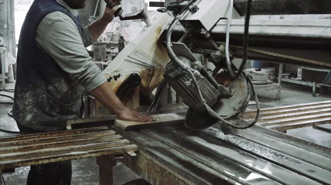 Worker uses saw machine for cutting marble stone piece 스톡 동영상 68073873