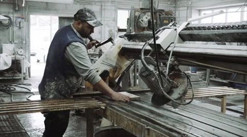 Worker uses saw machine for cutting marble stone piece 스톡 동영상 68074350