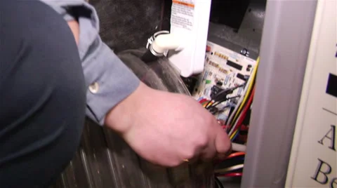 Worker uses specialized vacuum to clean electrical panel Stock Footage 42958472
