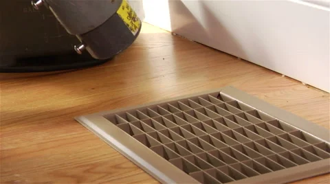 Worker uses spray to clean vent cover Stock Footage 42961707