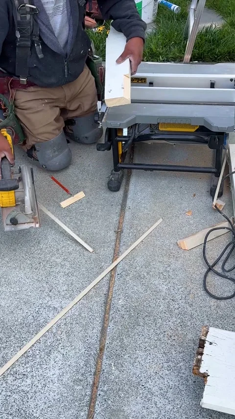 Worker Uses Table Saw on Outdoor Tiling Job Stock Footage 313357994