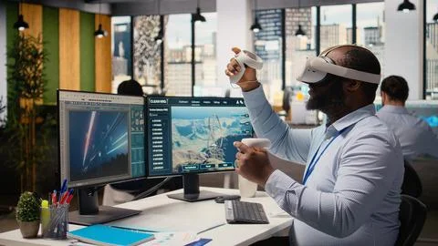 Worker uses VR headset to optimize electrical grid and wind farm layout Stock Photos