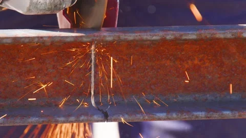 Worker using angle grinder cutting a metal and casting sparks Stock Footage 181463551