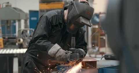 Worker using angle grinder, Stock Footage 103774643