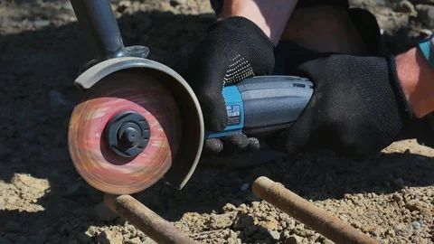 Worker Using Angle Grinder in home Stock Footage 128921781