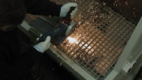 Worker Using Angle Grinder With Sparks Flying in Industrial Workshop, Wearing Stock Footage 312314924