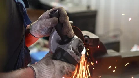 Worker Using Angle Grinder in Workshop Stock Footage 345567517