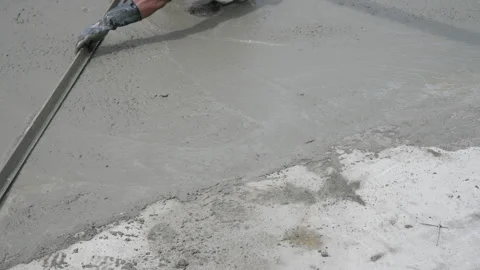 Worker Using Bull Float to Finishing Surface of Concrete. Construction Concept Video stock 282642171