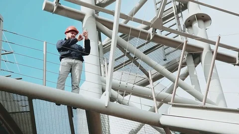 Worker using cell phone Stock Footage 73470493