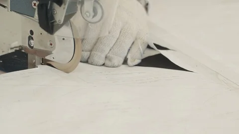 Worker using a circular fabric knife Stock-Footage 118251990