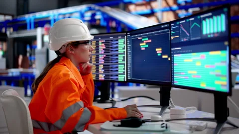 Worker Using A Computer To Manage Warehouse Logistics Stock Footage 338169858
