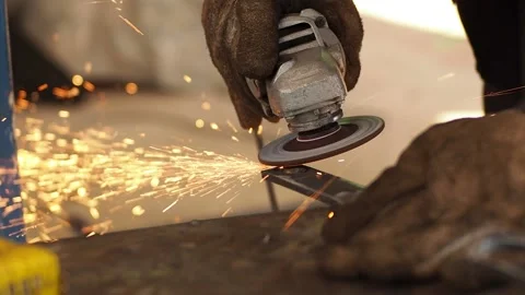 Worker using cutter circular metal has lighting spark, Man hard worked and s Stock Footage 136868043