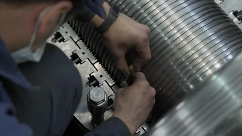 Worker using a depth micrometer and penetrating it inside the teeth of component Stock Footage 160968545
