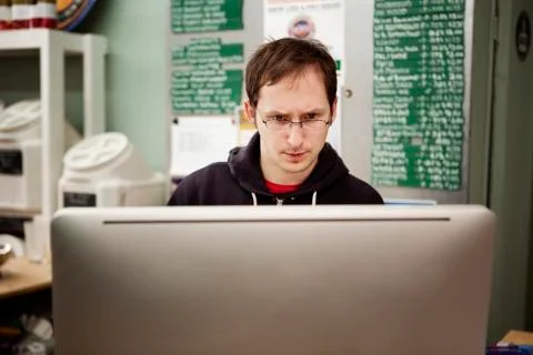 Worker using desktop computer in workshop Stock Photos