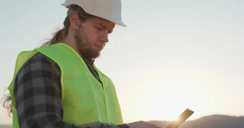 Worker using digital tablet computer on work site. Engineer businessman in Stock Footage 195253991