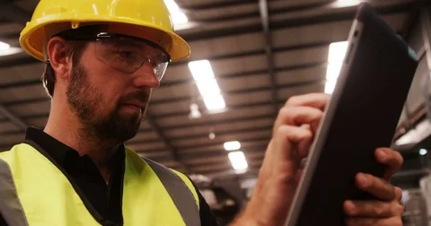 Worker using digital tablet Stock Footage