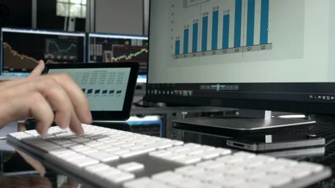 Worker using digital tablet in a stock market office Stock-Footage 210435012