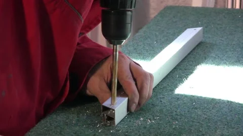 Worker using a drill press in furniture factory. Stock Footage 57216426