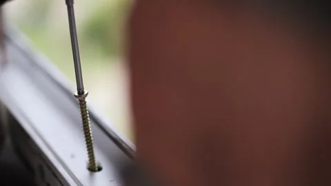 Worker using electric drill to screw metal at construction site Stock Footage 315956633