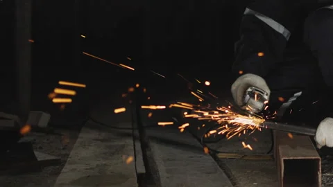 Worker using electric grinder machine cutting steel. Overtime, workload. Stock Footage 175680708