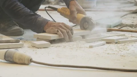 Worker using electric grinding machine for cutting ceramic tiles. 動画素材 232233505