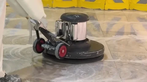 Worker using a floor buffer inside The Senate of Canada Building. Stock Footage 345890802