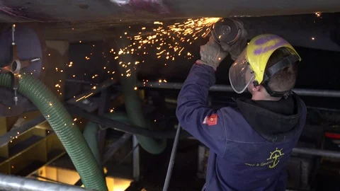 A worker using a grinder Stock Footage 126694263