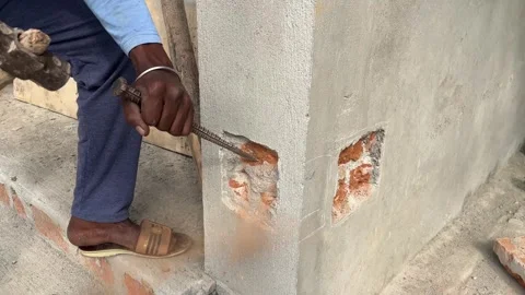 Worker using hammer and sickle breaking the wall Stock Footage 312323263