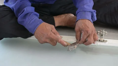 Worker using a hammer in woodwork construction Stock Footage 238909371
