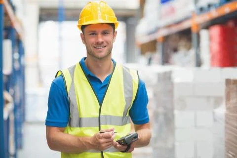 Worker using hand held computer Stock Photos