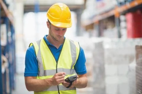 Worker using hand held computer Stock Photos