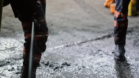 Worker using a high pressure water jet cleaner Video stock 334100754