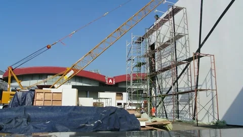 Worker using high-rise skyscraper in exhibition area Stock Footage 285021688