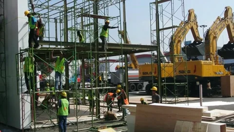 Worker using high-rise skyscraper in exhibition area 스톡 동영상 285110404